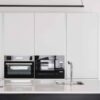 کابینت آشپزخانه نیکلند، کابینت سفید براق با فر و ماکروویو توکار